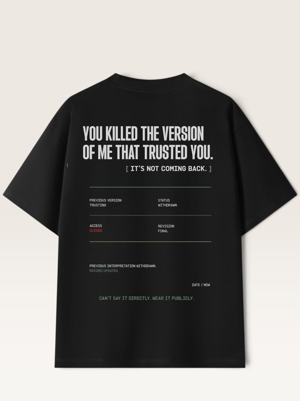 Black - short-sleeve t-shirt shown from the back, featuring a white typographic graphic with text and a minimalist terminal-style design on a light beige background.
