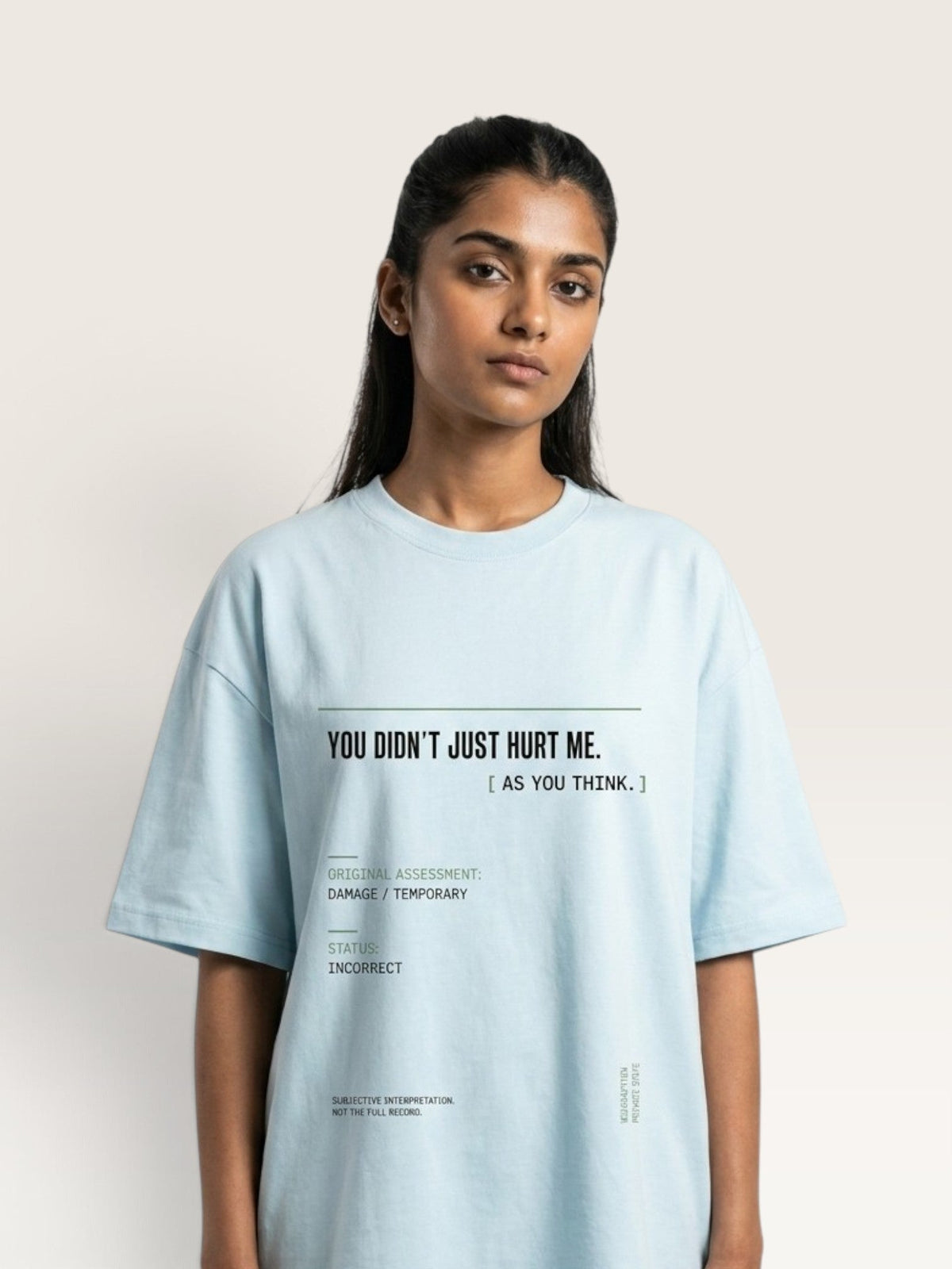 Sky Blue - A woman modeling an oversized light blue t-shirt with black printed text on the front that reads 'YOU DIDN'T JUST HURT ME. [ AS YOU THINK.