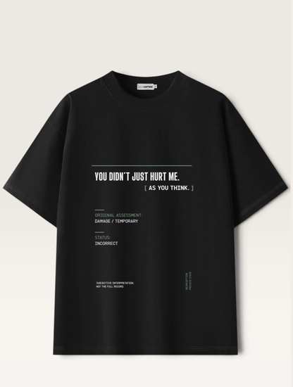 Black - short-sleeve t-shirt shown from the back, featuring a white typographic graphic with text and a minimalist terminal-style design on a light beige background.