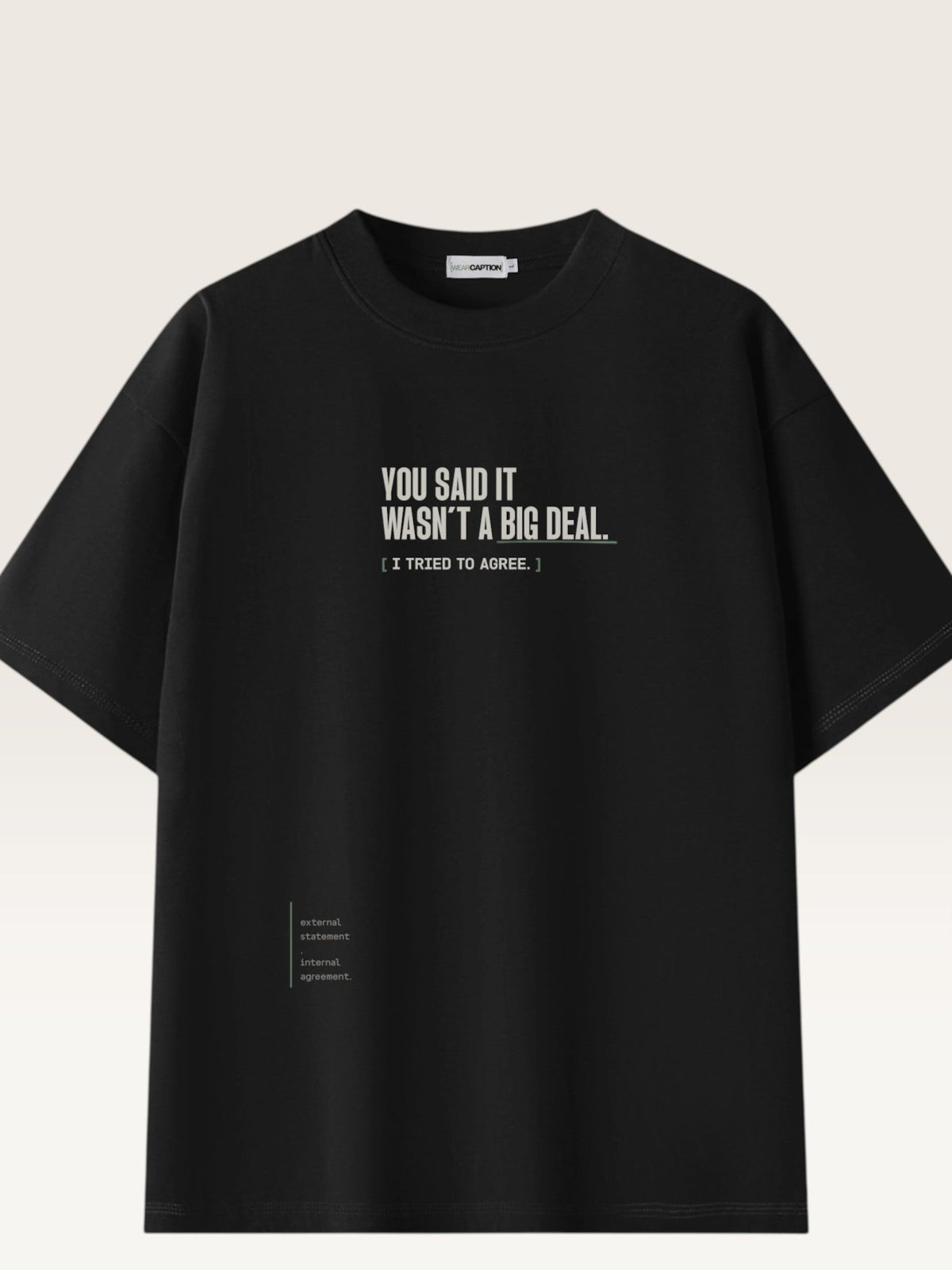 Black - heavyweight cotton oversized t-shirt with white IT WASN'T A BIG DEAL graphic print on the front