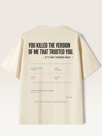 Mild Apricot - short-sleeve t-shirt shown from the back, featuring a black typographic graphic with a quote and a faux database entry layout.