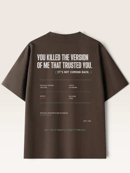 Coffee - A dark brown short-sleeve t-shirt shown from the back, featuring white graphic text and a minimalist terminal-style text layout printed on the back.