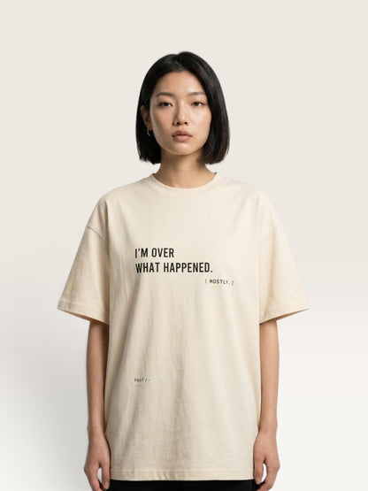 WEARCAPTION oversized beige heavyweight cotton t-shirt with black text print on the front, worn by a model.