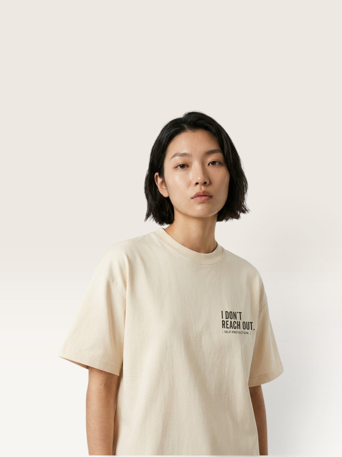 Mild Apricot  WEARCAPTION  heavyweight cotton oversized t-shirt with white I DON'T REACH OUT graphic print on the chest