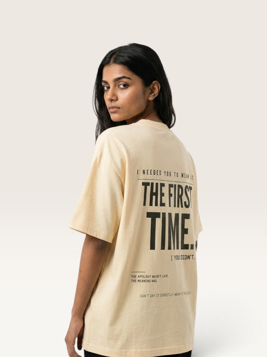 Apricot WEARCAPTION oversized beige heavyweight cotton t-shirt with black graphic text on the back worn by a woman