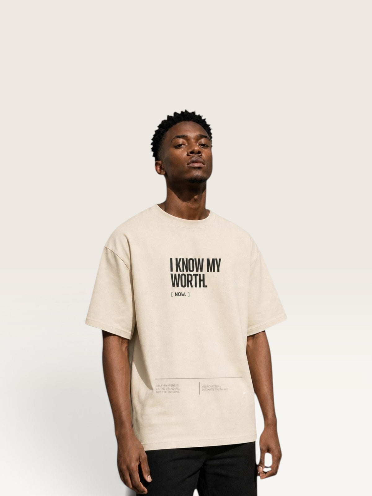 WEARCAPTION beige heavyweight cotton oversized t-shirt with I KNOW MY WORTH text print on a male model