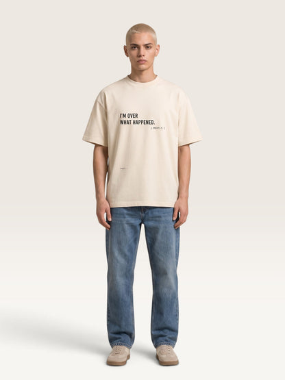 WEARCAPTION beige heavyweight cotton oversized t-shirt with black front text graphic worn by a male model