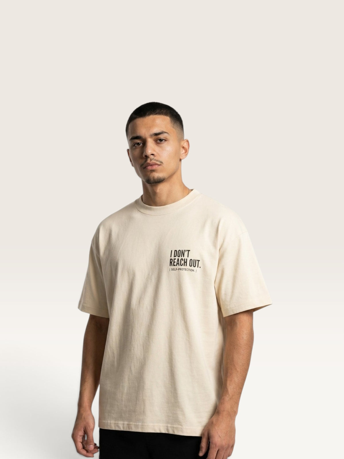 Mild Apricot  WEARCAPTION  heavyweight cotton oversized t-shirt with white I DON'T REACH OUT graphic print on the chest