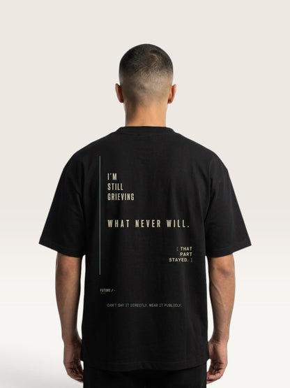 WEARCAPTION black heavyweight cotton oversized t-shirt with white and green text graphic on the back