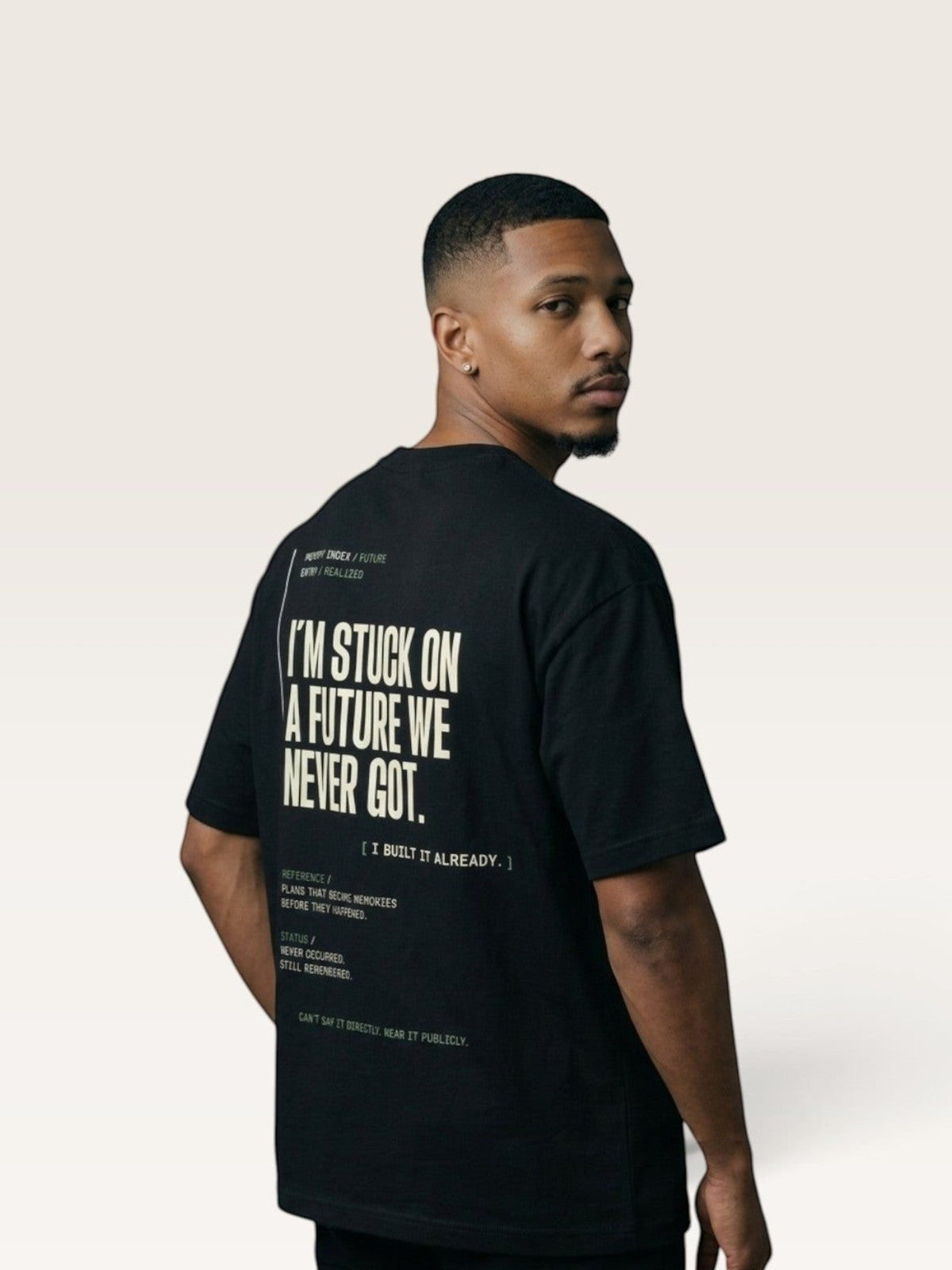 Black  WEARCAPTION black heavyweight cotton oversized t-shirt with white graphic text on the back worn by a man