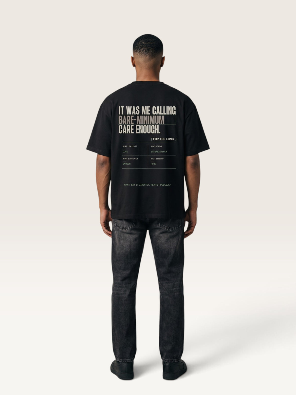Black WEARCAPTION heavyweight cotton oversized t-shirt with white and green graphic text print on the back