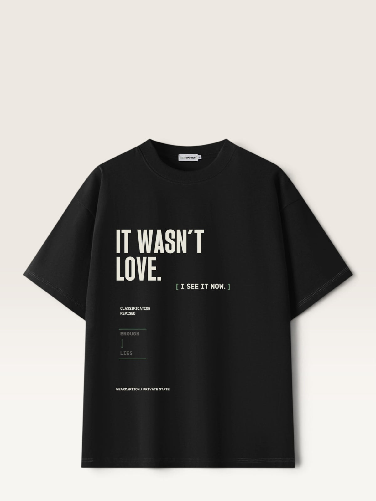 Black WEARCAPTION heavyweight cotton oversized t-shirt with white and green graphic text print on the back