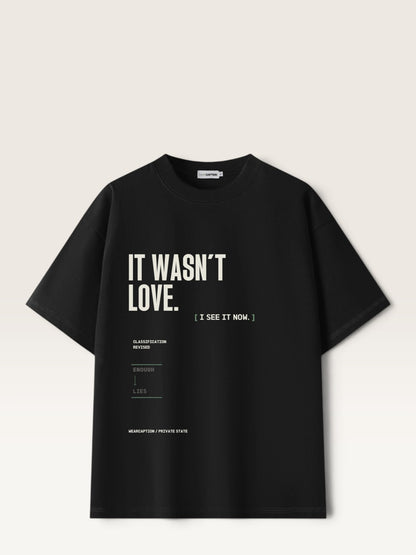 Black WEARCAPTION heavyweight cotton oversized t-shirt with white and green graphic text print on the back