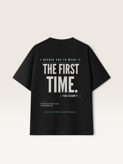 Black WEARCAPTION heavyweight cotton oversized t-shirt with white and green text graphic on the back