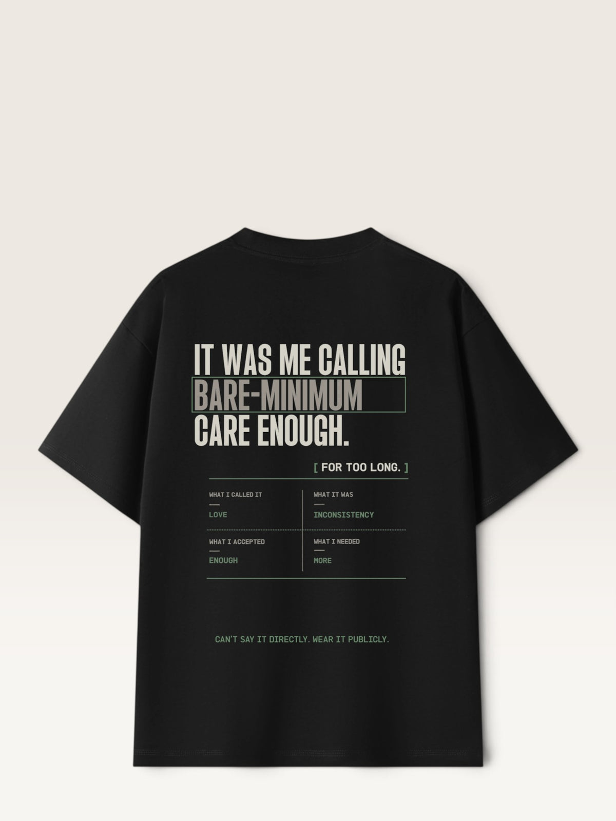 Black WEARCAPTION heavyweight cotton oversized t-shirt with white and green graphic text print on the back