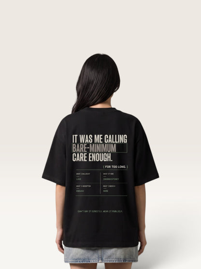 Black WEARCAPTION heavyweight cotton oversized t-shirt with white and green graphic text print on the back