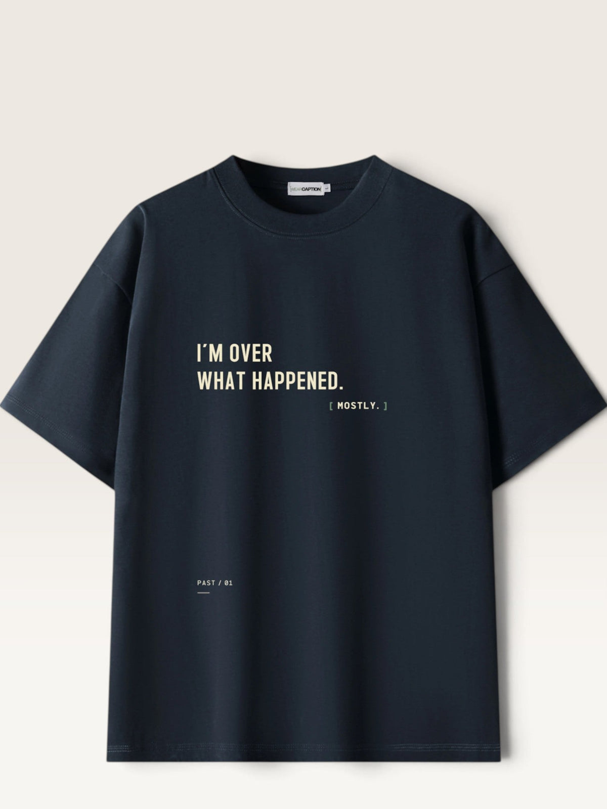 WEARCAPTION black heavyweight cotton oversized t-shirt with I'M OVER WHAT HAPPENED text printed on the front