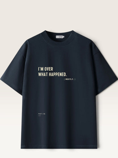 WEARCAPTION black heavyweight cotton oversized t-shirt with I'M OVER WHAT HAPPENED text printed on the front