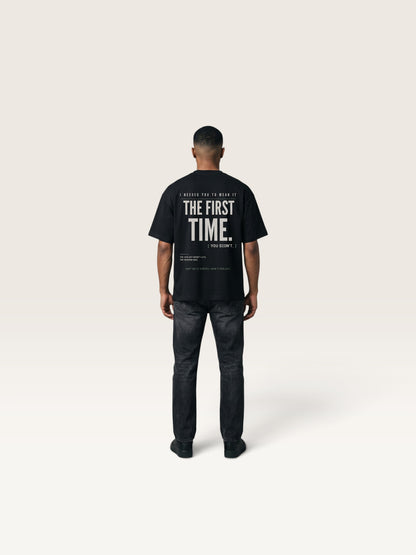 Black WEARCAPTION black heavyweight cotton oversized t-shirt with white typographic back print on a man from behind