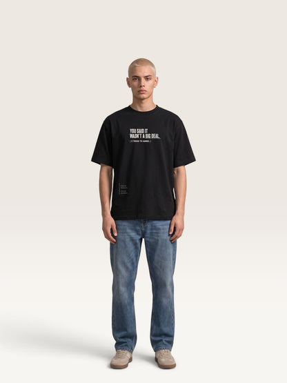 Black - heavyweight cotton oversized t-shirt with white IT WASN'T A BIG DEAL graphic print on the front