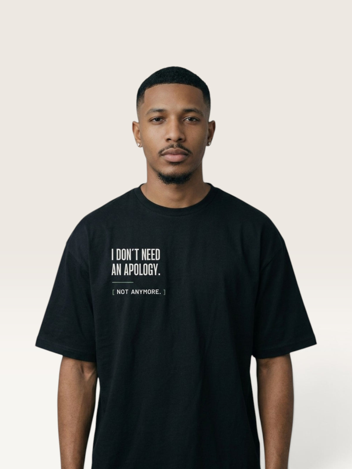 Black WEARCAPTION black heavyweight cotton oversized t-shirt with white I DON'T NEED AN APOLOGY text on the chest