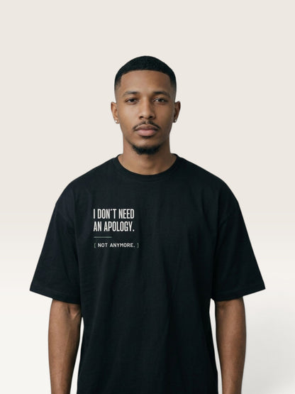 Black WEARCAPTION black heavyweight cotton oversized t-shirt with white I DON'T NEED AN APOLOGY text on the chest