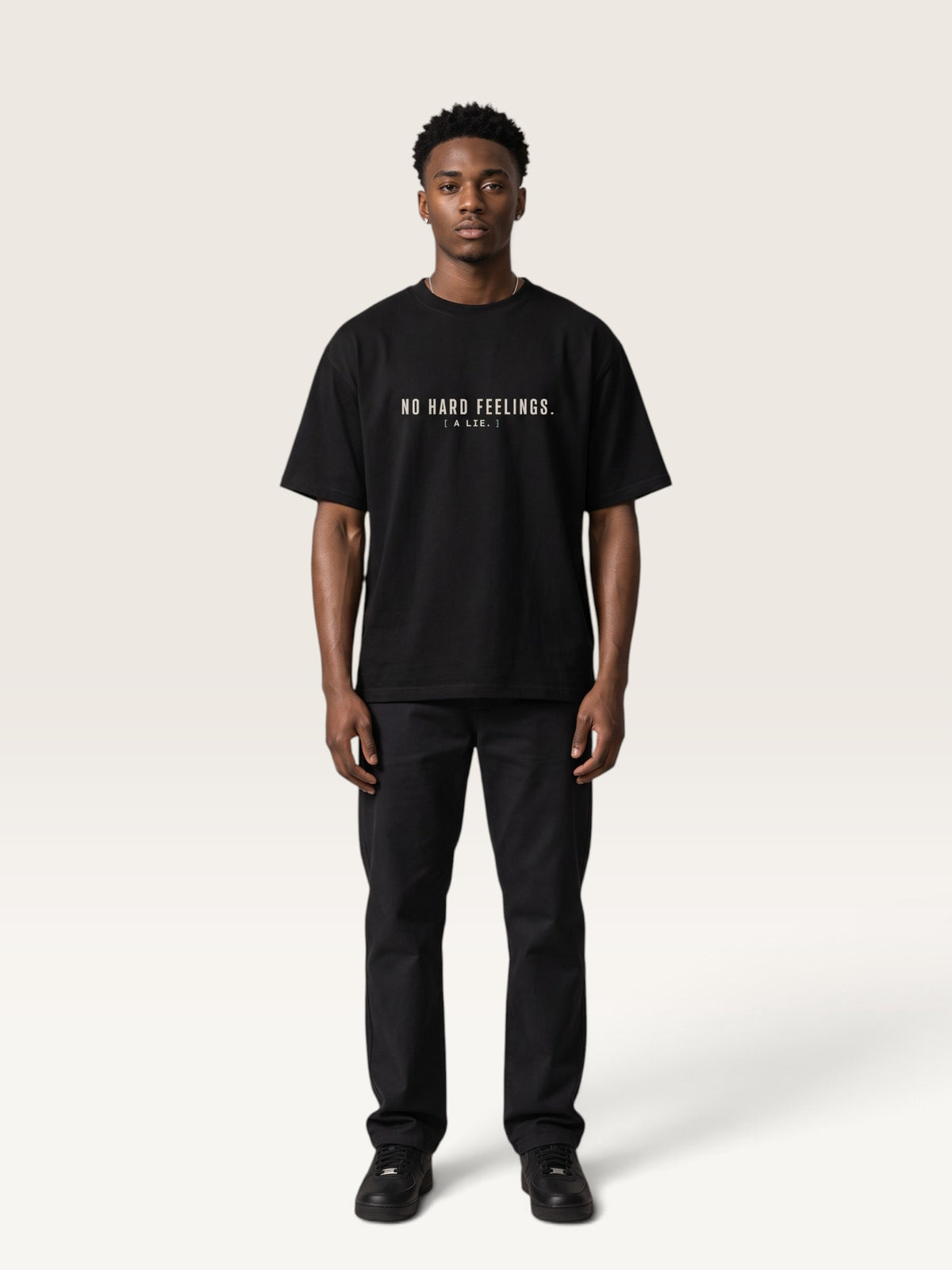 Black heavyweight cotton oversized t-shirt with white NO HARD FEELINGS A LIE text print on the front