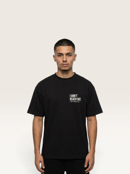 Black WEARCAPTION  heavyweight cotton oversized t-shirt with white I DON'T REACH OUT graphic print on the chest
