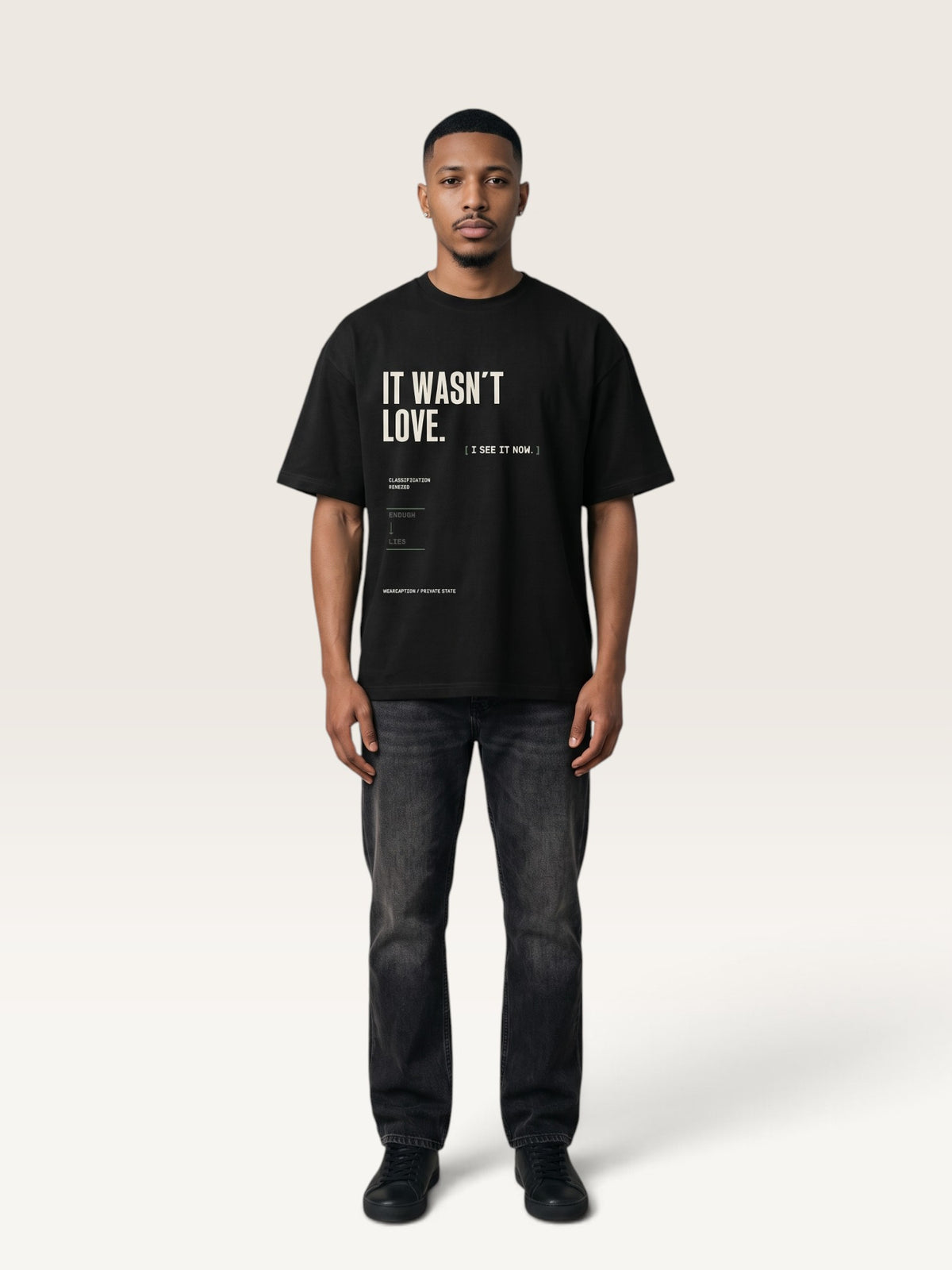 Black WEARCAPTION heavyweight cotton oversized t-shirt with white and green graphic text print on the back