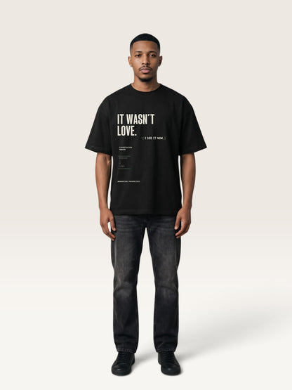 Black WEARCAPTION heavyweight cotton oversized t-shirt with white and green graphic text print on the back