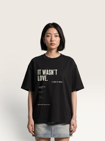 Black WEARCAPTION heavyweight cotton oversized t-shirt with white and green graphic text print on the back