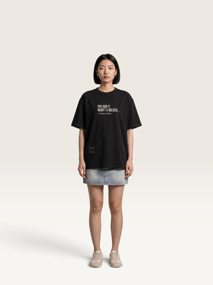 Black - heavyweight cotton oversized t-shirt with white IT WASN'T A BIG DEAL graphic print on the front