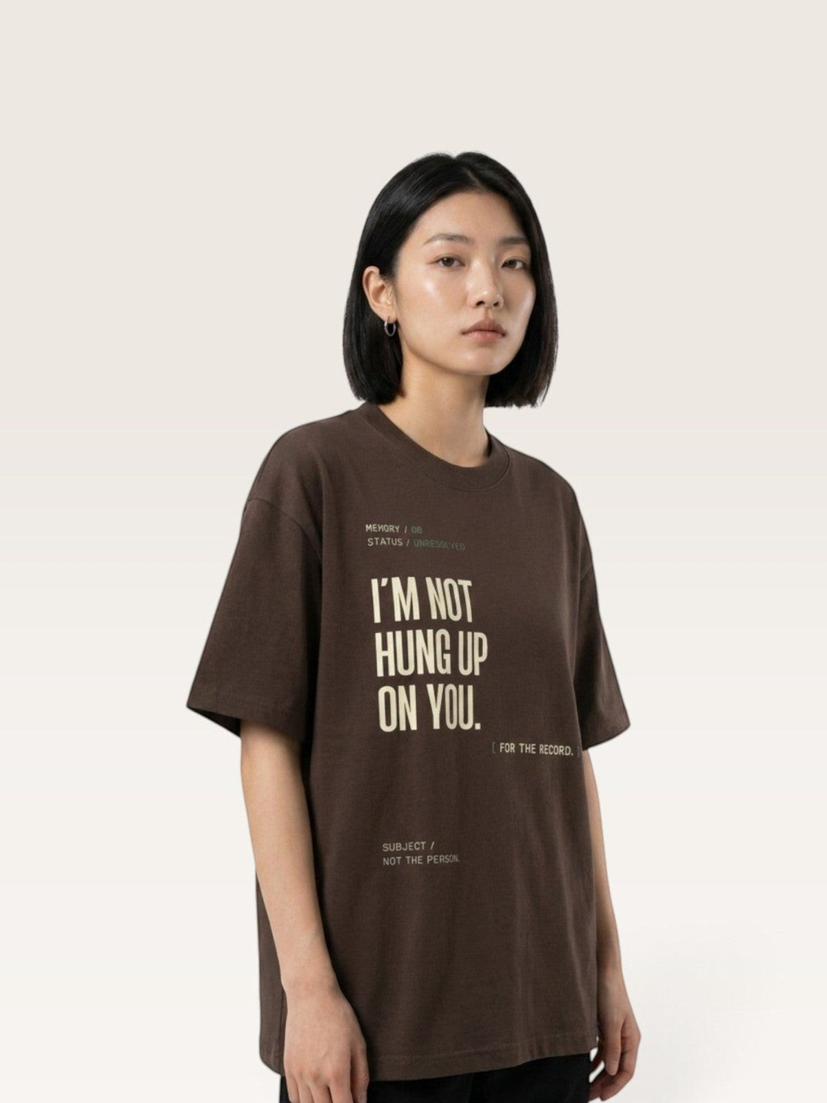 Coffee WEARCAPTION brown heavyweight cotton oversized graphic t-shirt with I'M NOT HUNG UP ON YOU text on a female model