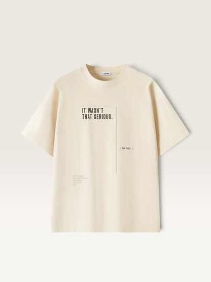 Mild Apricot WEARCAPTION heavyweight cream cotton t-shirt with IT WASN'T THAT SERIOUS graphic print in a boxy oversized fit