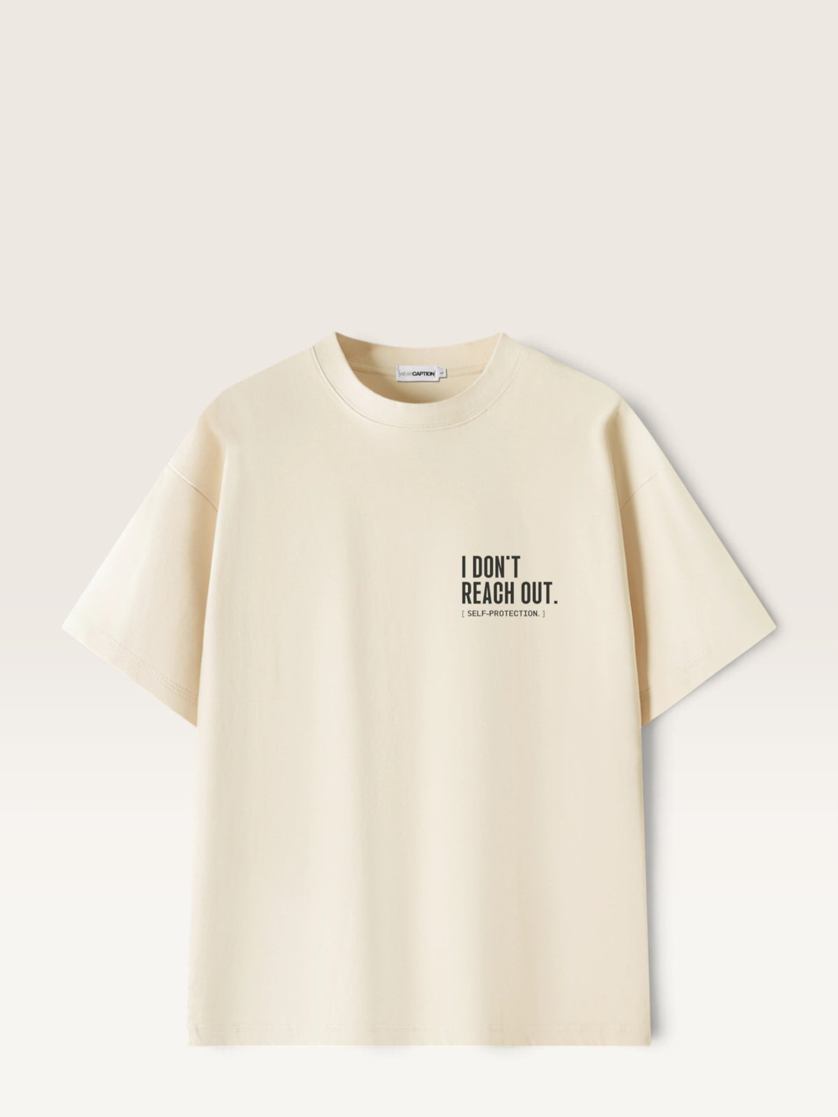 Mild Apricot  WEARCAPTION  heavyweight cotton oversized t-shirt with white I DON'T REACH OUT graphic print on the chest