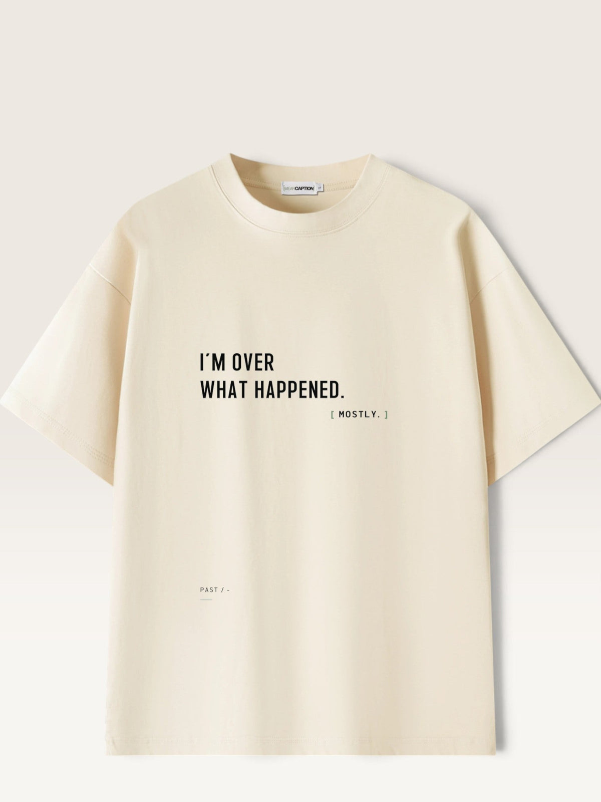 WEARCAPTION cream heavyweight cotton oversized t-shirt with black I'M OVER WHAT HAPPENED text print on the front.