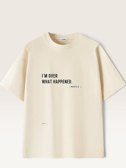 WEARCAPTION cream heavyweight cotton oversized t-shirt with black I'M OVER WHAT HAPPENED text print on the front.