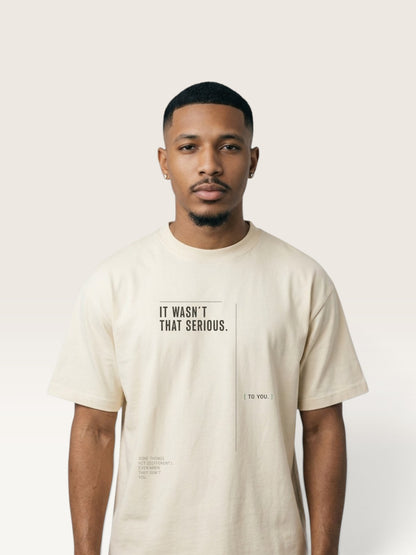 Mild Apricot WEARCAPTION oversized cream heavyweight cotton t-shirt with IT WASN'T THAT SERIOUS graphic print on the chest