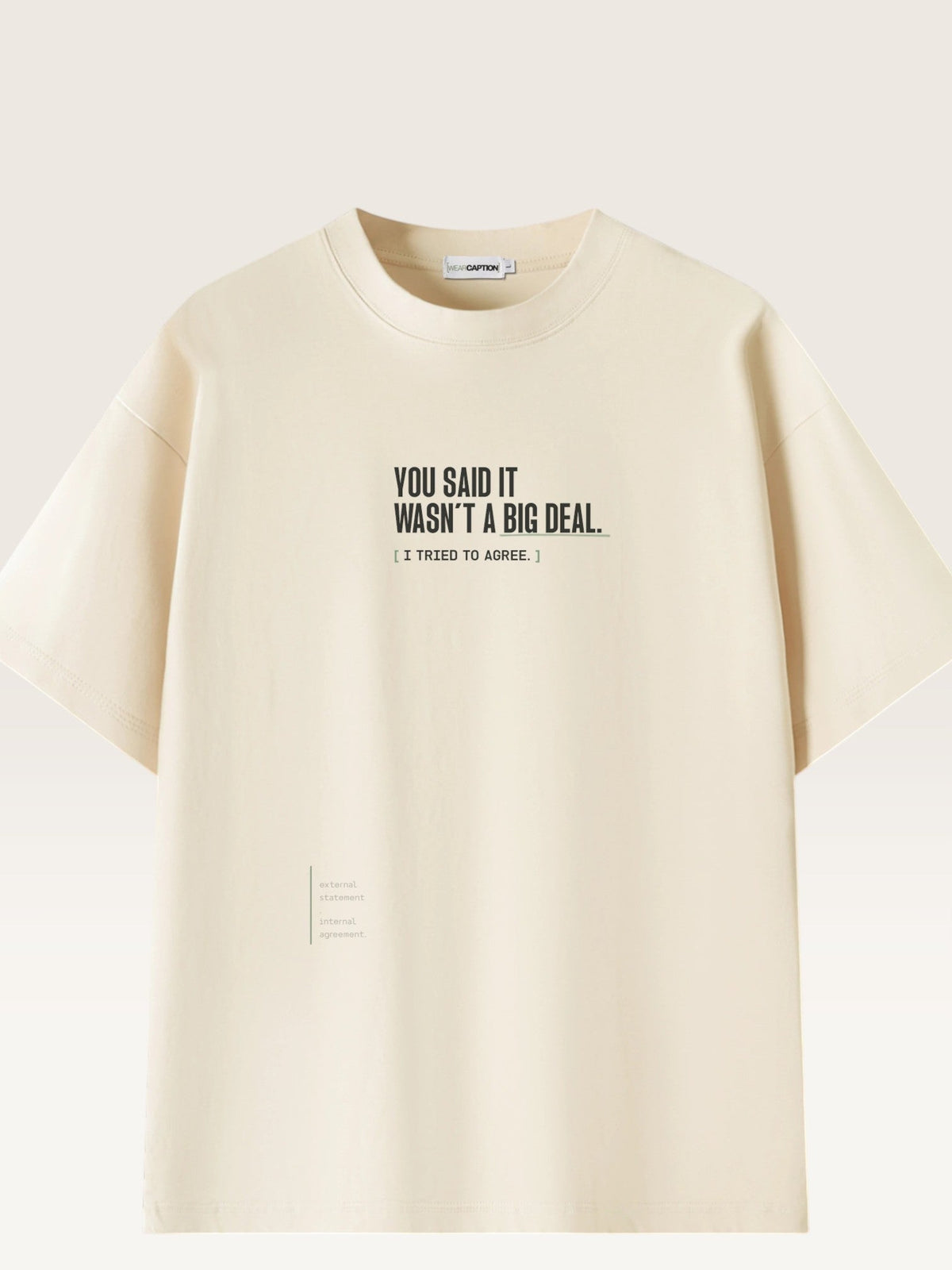Mild Apricot - heavyweight cotton oversized t-shirt with white IT WASN'T A BIG DEAL graphic print on the front