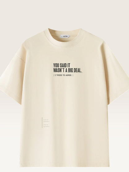 Mild Apricot - heavyweight cotton oversized t-shirt with white IT WASN'T A BIG DEAL graphic print on the front