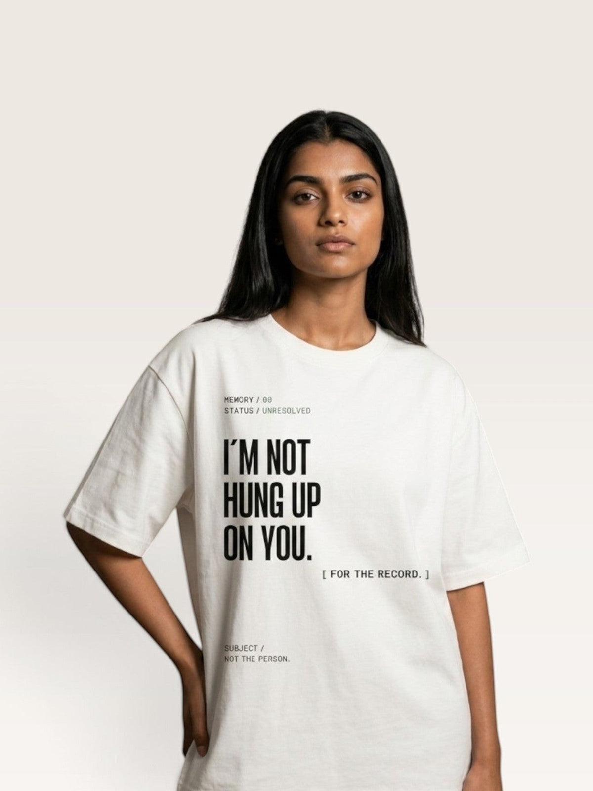 White  A model wearing a WEARCAPTION heavyweight white cotton t-shirt with black typographic text on the front.