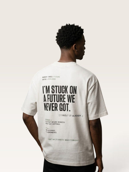 White  WEARCAPTION heavyweight white cotton t-shirt with black typographic back print on a model, oversized boxy fit.