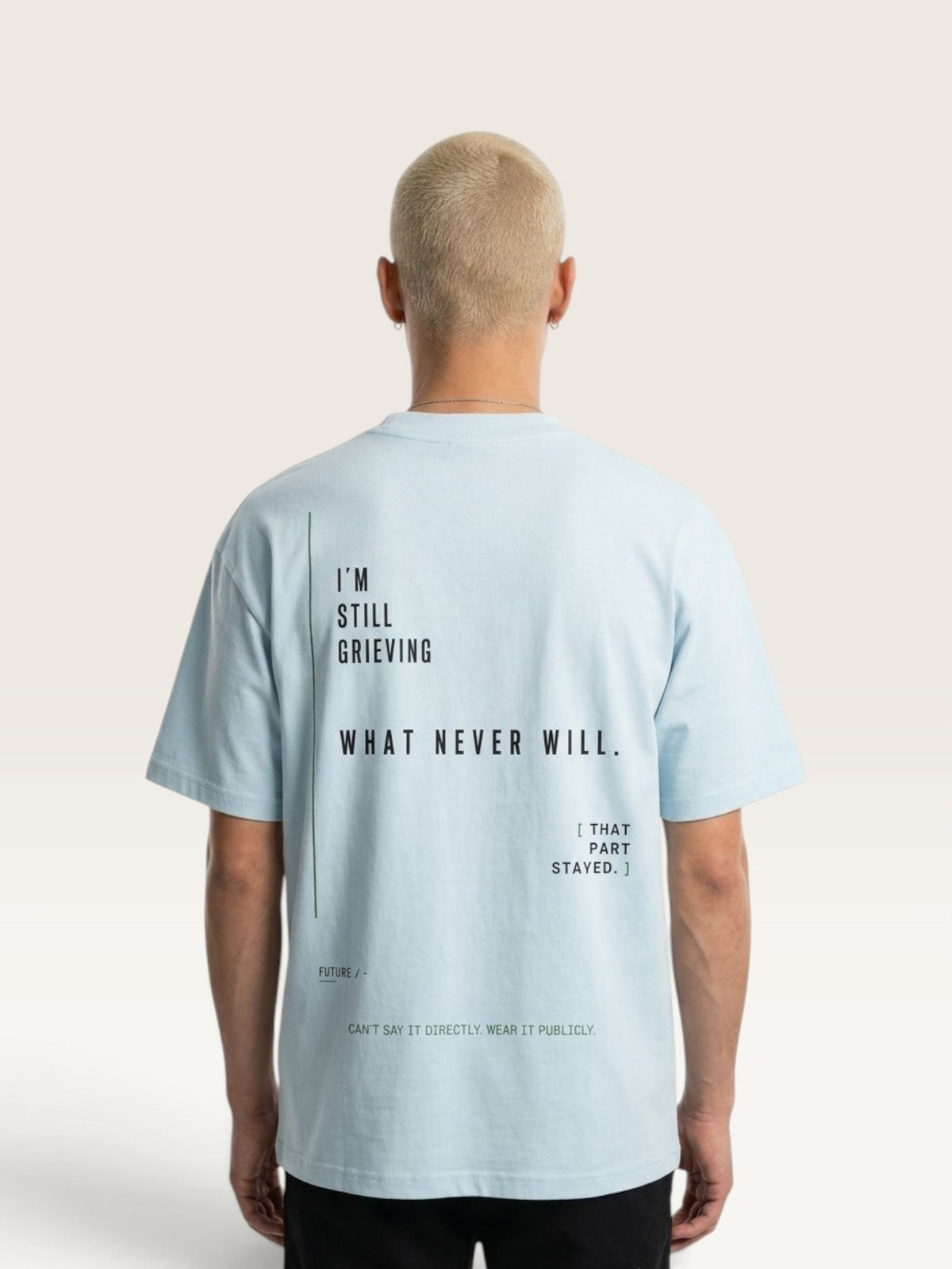 WEARCAPTION light blue heavyweight cotton oversized t-shirt with black graphic text on the back, worn by a model.