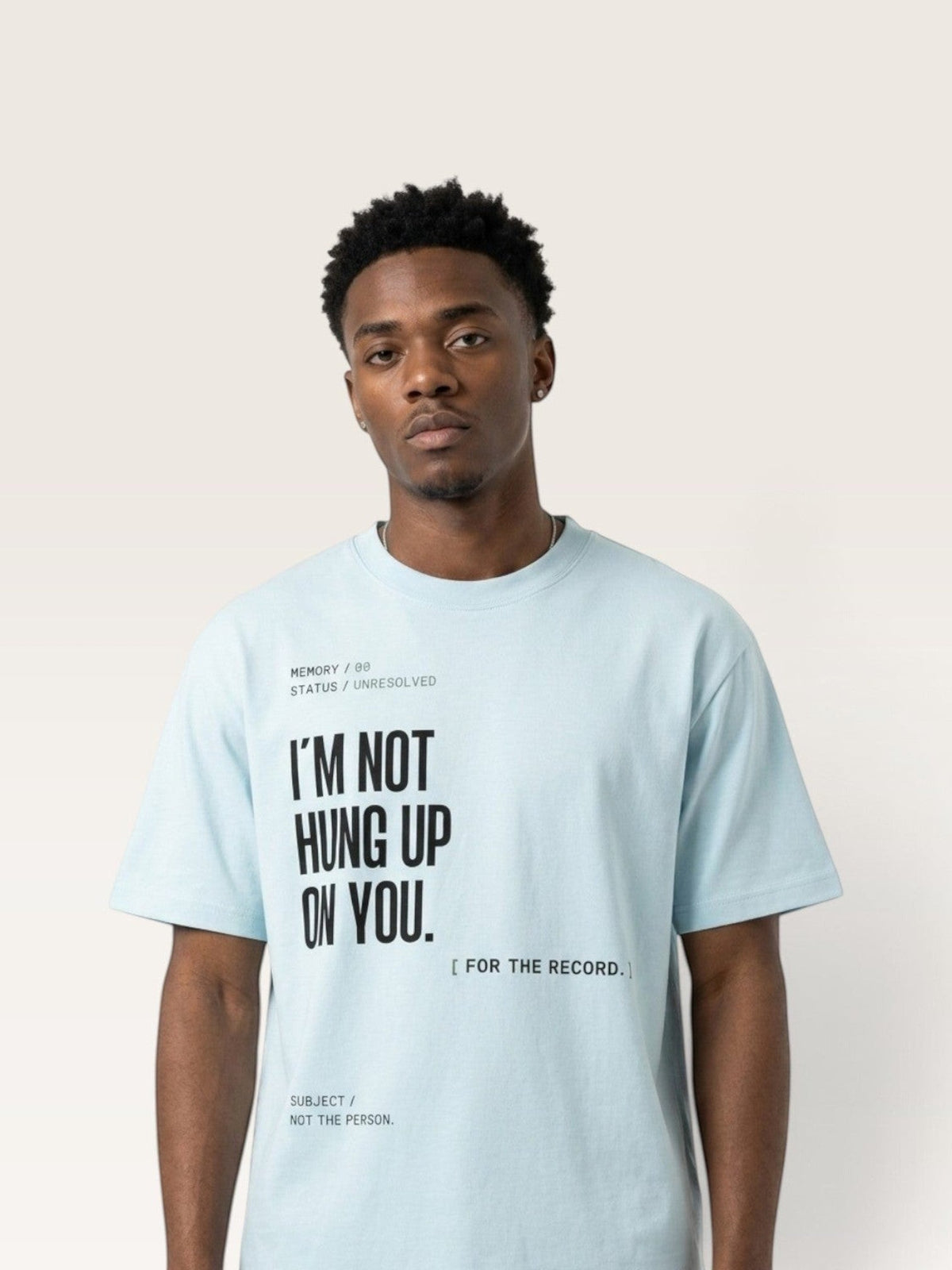 Sky Blue WEARCAPTION light blue heavyweight cotton oversized t-shirt with black text graphic on a male model
