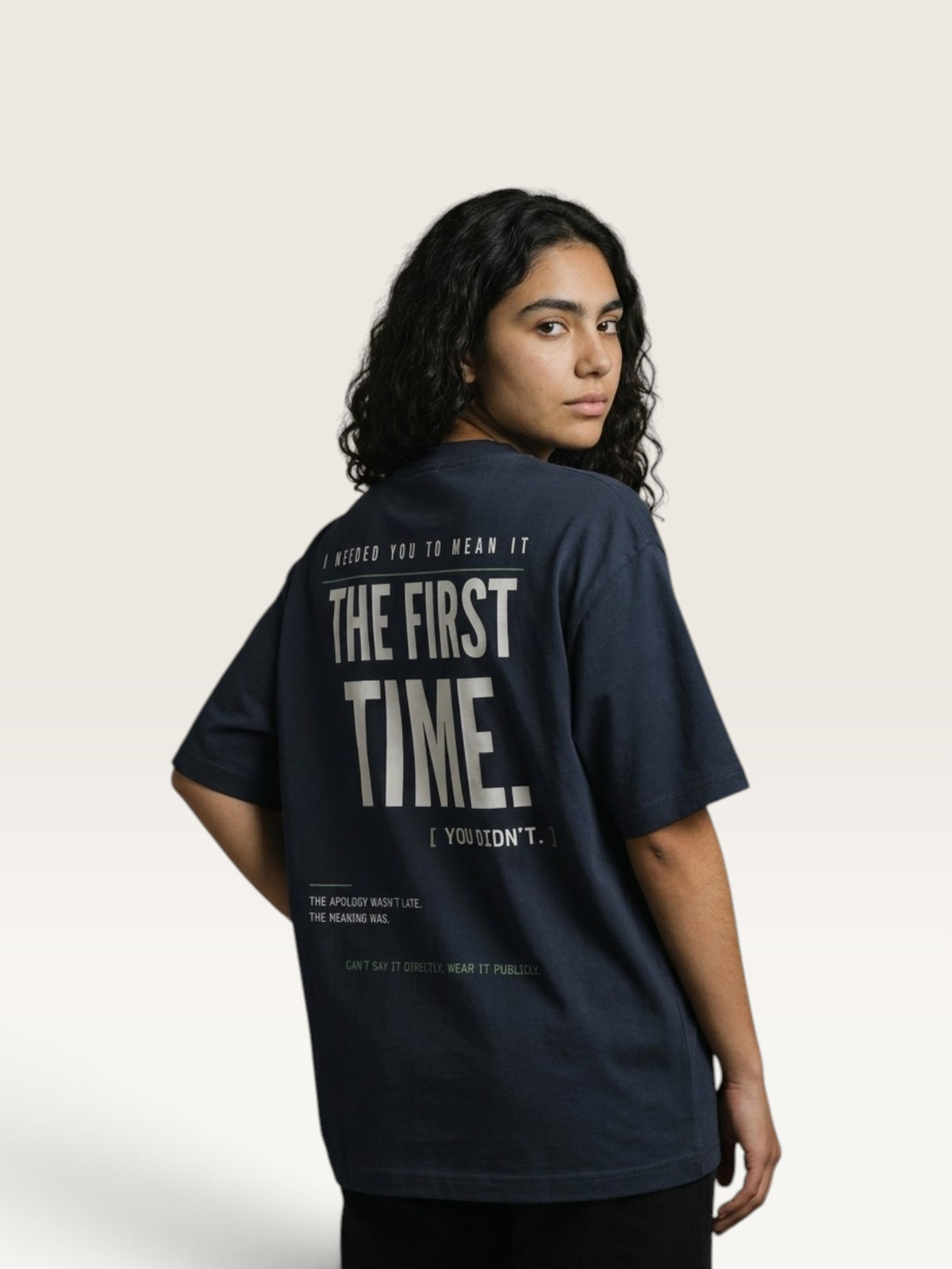 Navy Blue  WEARCAPTION navy heavyweight cotton oversized t-shirt with bold white text graphic on the back, worn by a woman.