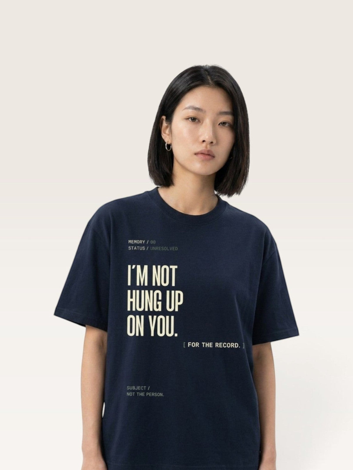 Navy Blue WEARCAPTION heavyweight navy cotton t-shirt with I'M NOT HUNG UP ON YOU graphic print worn by a woman