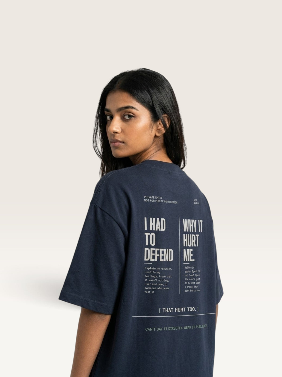 Navy Blue WEARCAPTION navy heavyweight cotton oversized t-shirt with white back graphic text print worn by a woman
