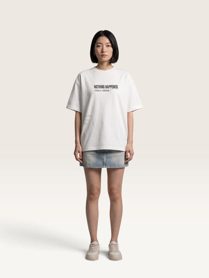 WEARCAPTION Nothing Happened oversized white heavyweight cotton t-shirt with black text on a model