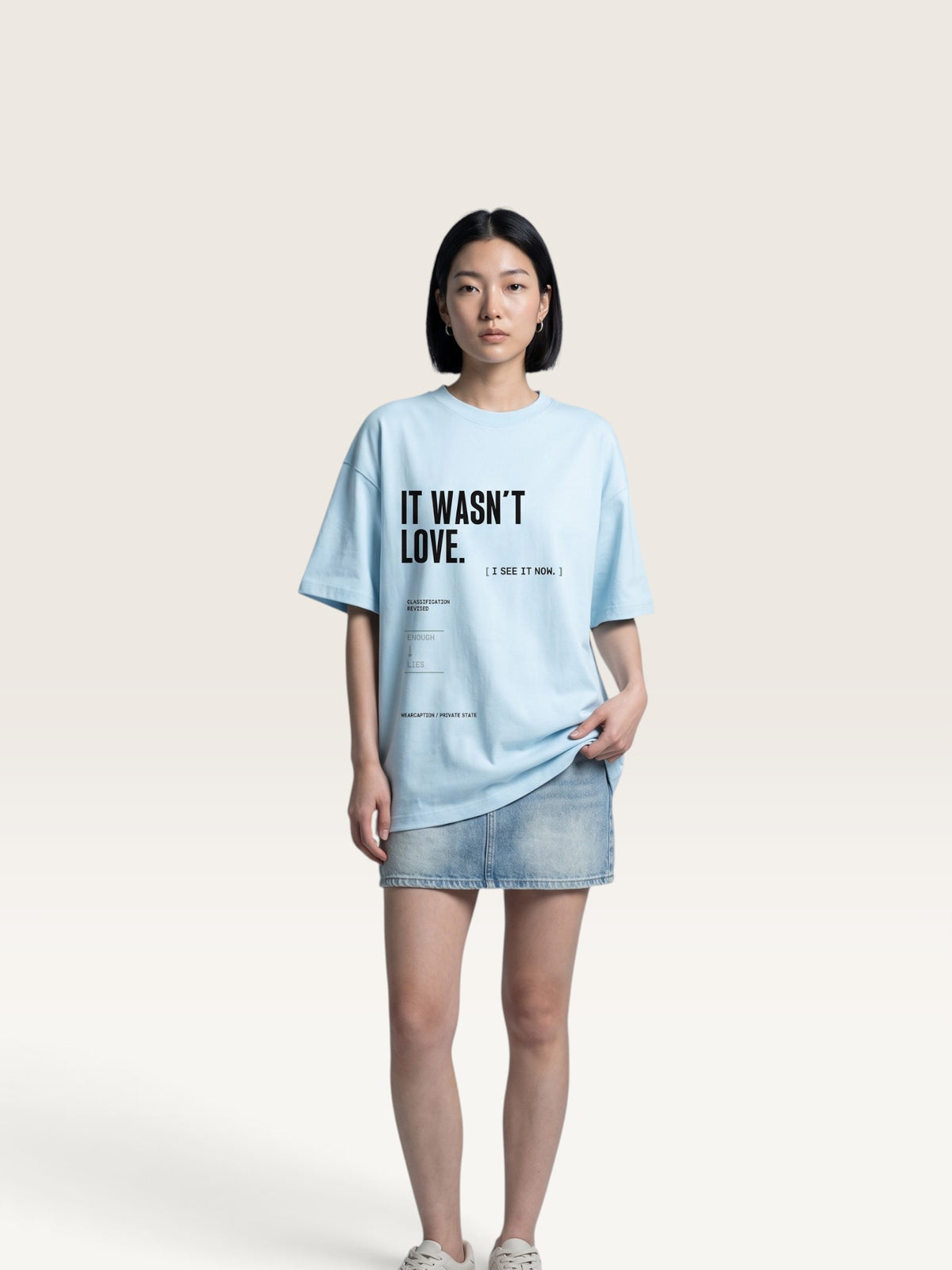 Sky Blue WEARCAPTION heavyweight cotton oversized t-shirt with white and green graphic text print on the back
