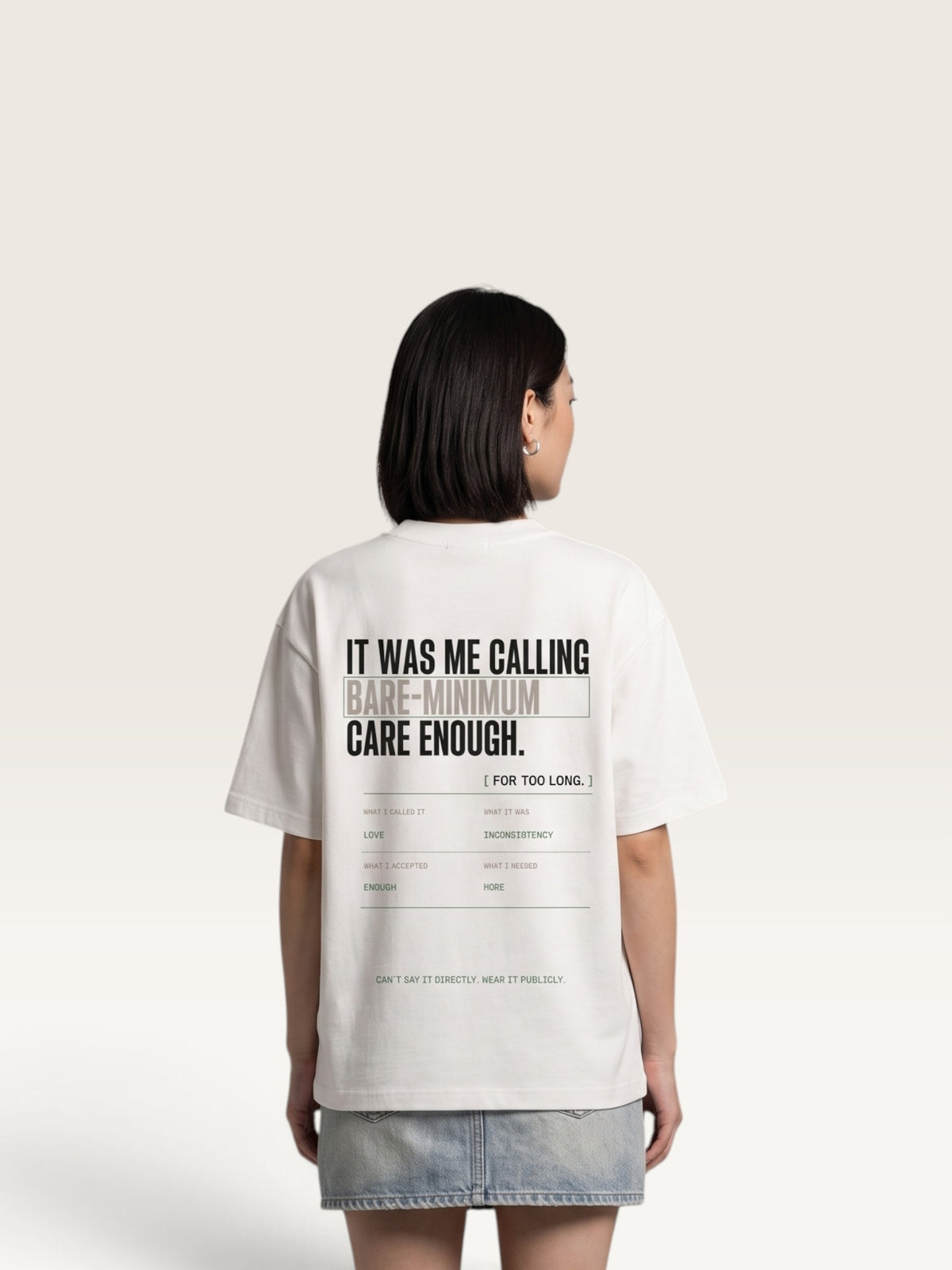 White WEARCAPTION heavyweight cotton oversized t-shirt with white and green graphic text print on the back